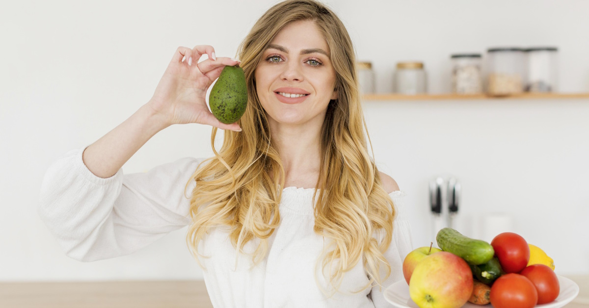 woman-blogger-holding-avocado