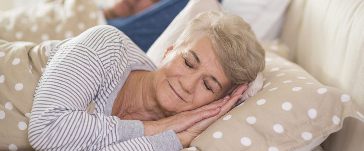 Woman and her husband sleeping comfortably